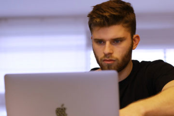 Man studying Krav Maga videos online